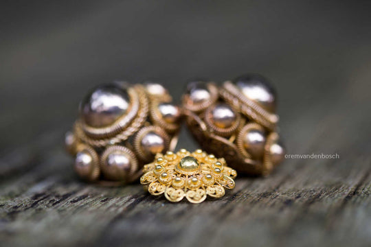 Golden Zeeland throat buttons and brooch