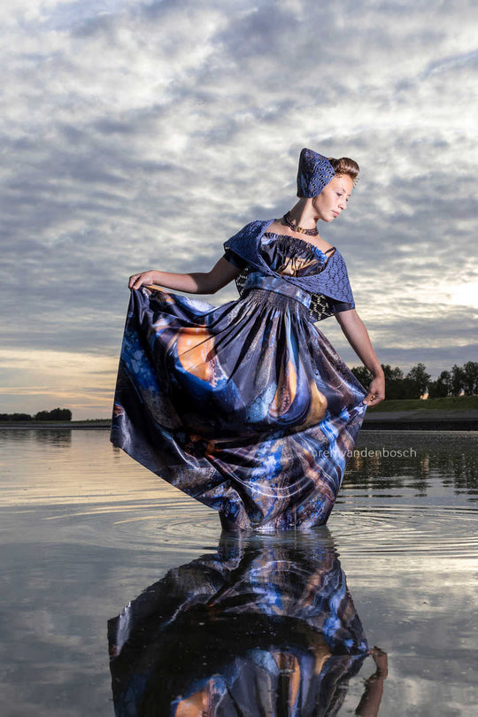 Iris in modern Walcheren mussel costume in the sea