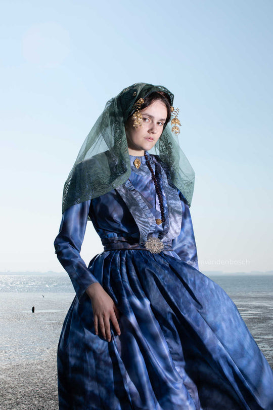 Portrait of Rosalyn in Tholen traditional costume at sea